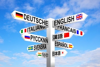 Different sign posts pointing to different countries and languages